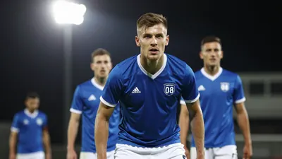 A tight action crop of an anonymous Sarpsborg 08 player in a 4-2-3-1 formation, with a blue jersey and white shorts...