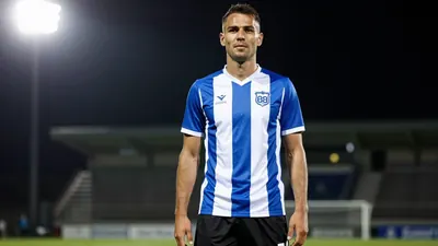A photorealistic image of an anonymous Sarpsborg 08 player, aged 25-30, wearing a blue and white striped jersey with a...